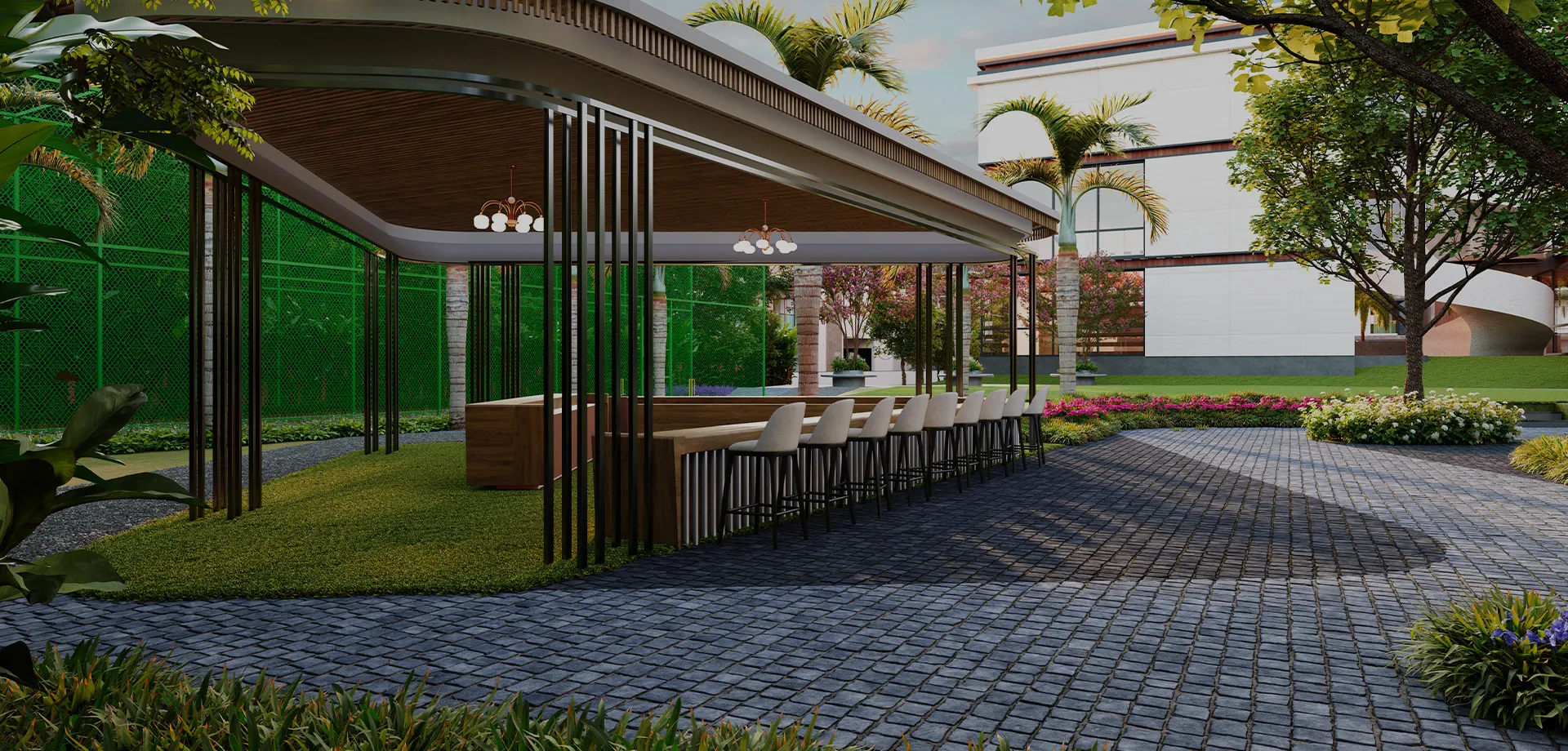 Outdoor kitchen and dining counter in landscaped clubhouse area
